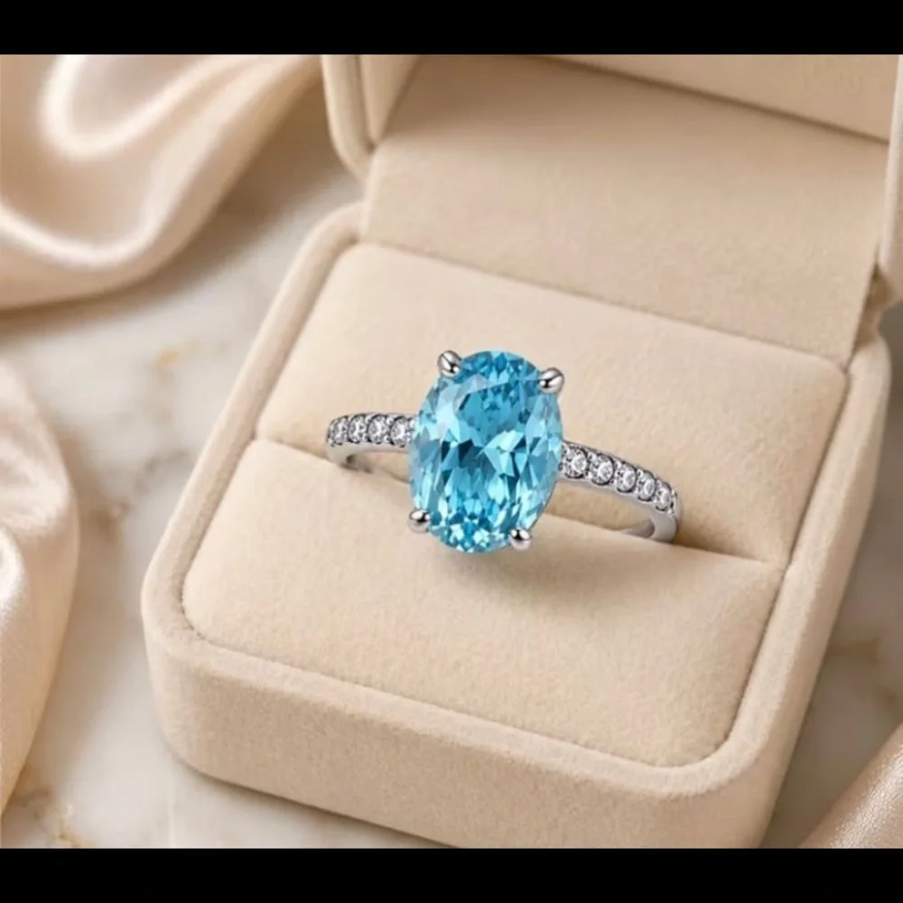 Sterling Silver Oval Blue Topaz Ring with Pavé Accents